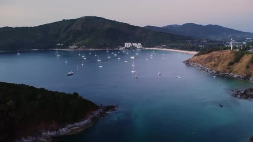 Serene Landscape of Island with Mountains and Sea Bay with Floating Boats Filmed By Drone