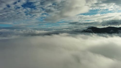 Aerial View of Clouds and Mountains at Sunrise