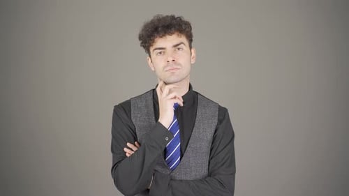 Pensive Man Thinking Deeply in Studio