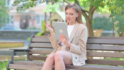 Businesswoman Doing Video Chat on Tablet Outdoor