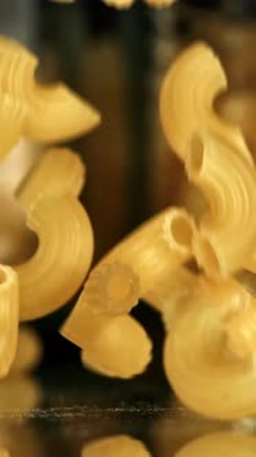 Super Slow Motion Dry Macaroni Pasta Filmed on a Highspeed Camera at 1000 Fps