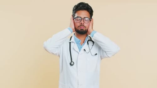 Doctor Gesturing and Covering His Ears, Headache