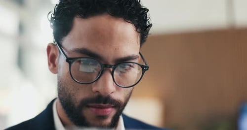 Glasses, reading and business man with online research, strategy or analysis for review