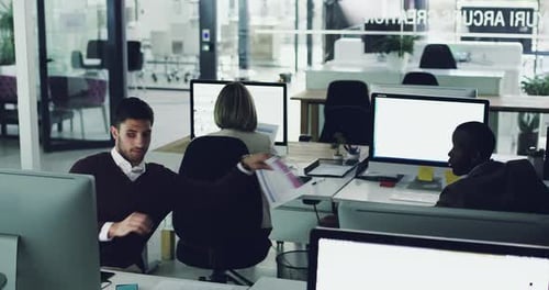 4k footage of a group of diverse businesspeople working on computers in their office