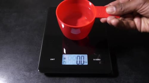 Measuring Cup on Digital Kitchen Scale