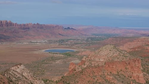 Expansive View of Moab Canyon with Town in the Rugged Desert Landscape