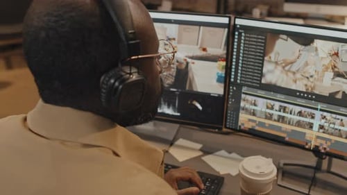 Male Freelancer Working on Footage Drinking Coffee