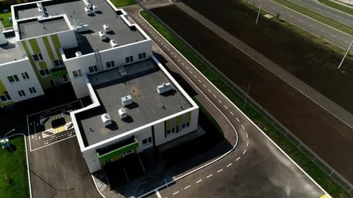 Territory of School with Wellkept Road and Football Fields