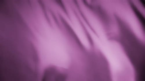 Silky purple fabric waving in the wind. Abstract texture background