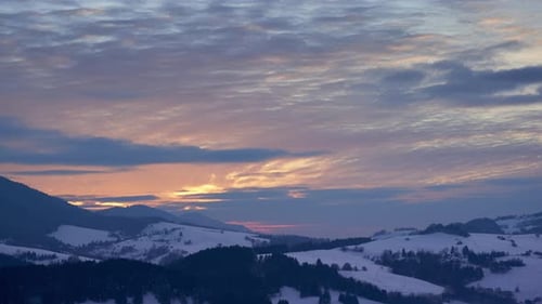 Snowy Hills Landscape at a Beautiful Winter Sunrise
