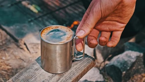 Prepare SelfMaking Aromatic Coffee on a Camping Fire in Nature