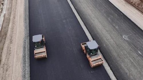 Roller Trucks Press Asphalt Covering on Road Lane Fpv