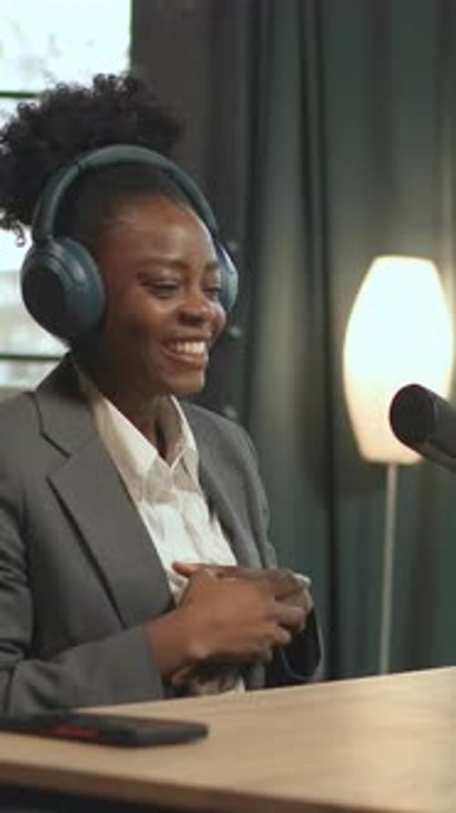 Lively Lady Hosting Recording Session Energetic Woman Speaking Into Microphone During Lively Podcast