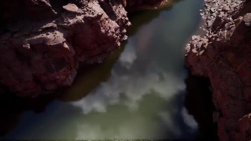 Reflections of Clouds in the Calm Waters of the Colorado River Canyon
