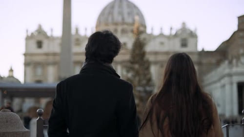 Happy Italian Couple Walk Up to Look at the Basilica and Hug