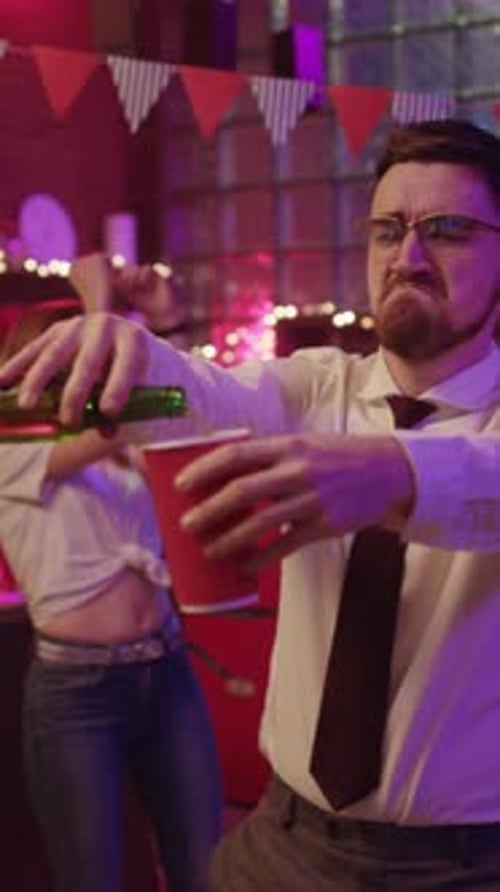 Young Adult Man Dancing at Party in Urban Bar