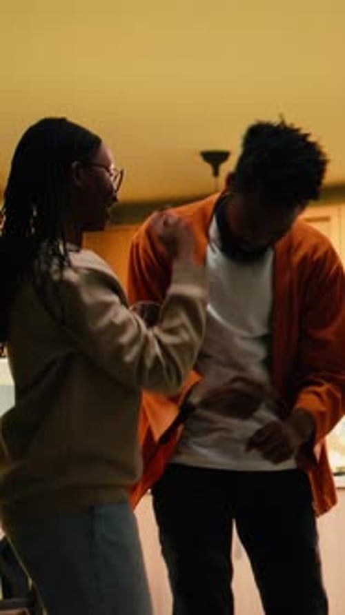 Joyful Couple Dancing in Their Cozy Home Kitchen