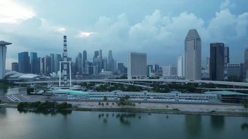 Drone wide orbiting shot of Formula 1 One Paddock Area. Street Circuit Racing Track, Singapore skysc