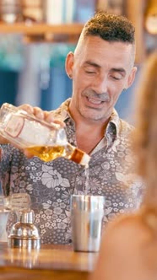 Bartender Preparing Cocktail Drink at Bar in Daytime