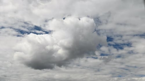 Beautiful Puffy White Cumulus Clouds And Wispy
