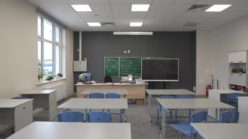Empty Classroom with Desks and Blackboard