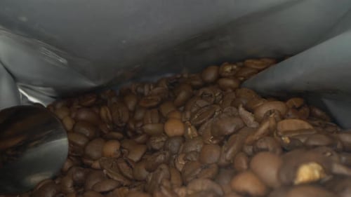 view of coffee beans inside the package. Look to the coffee beans from the eyes of an ant.