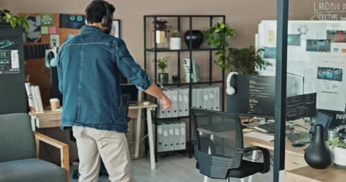 Programmer, happy and dance in office to achievement, good mood and positive energy at tech