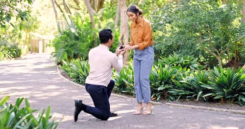 Young Couple Gets Engaged in Lush Green Park