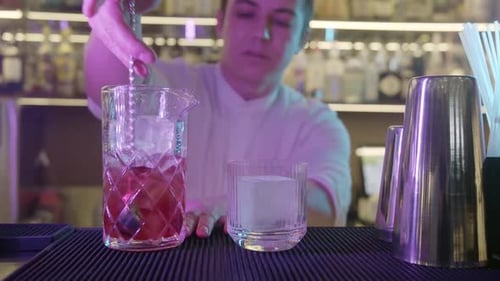 Bartender Making Alcohol Cocktails in Bar