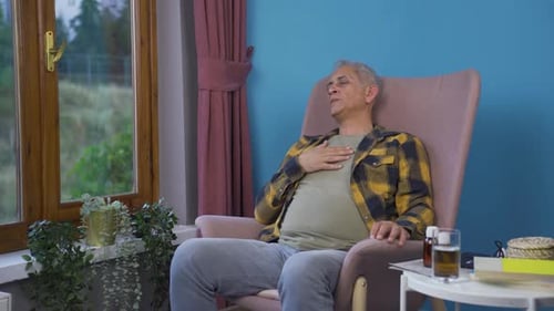 Man with shortness of breath is breathing hard.