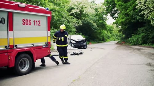 Burning Car Rescue by Firefighters