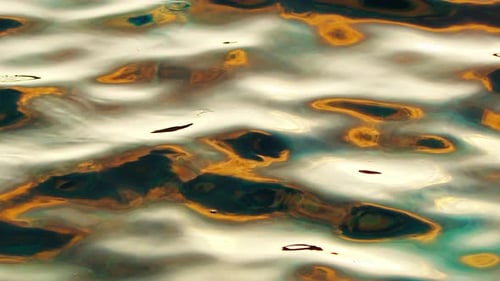 Calm Sea Surface with Colourful Ripples and Waves