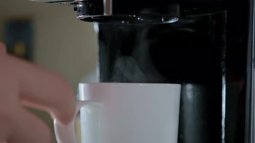 Close Up Shot of Pouring a Hot Drink in White Cup Fresh Cafe in the Kitchen of Home Slow Motion