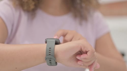 Close up of African Female Hand Using Smartwatch