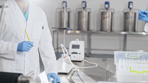 Scientists Working in Clean Modern Laboratory