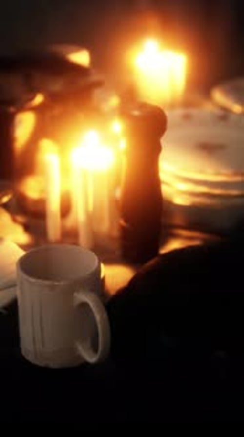 Warm Flickering Candlelight on a Dinner Table Ambiance