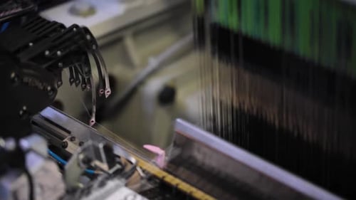 Close up of Textile Fabric Operating Rapidly for Weaving
