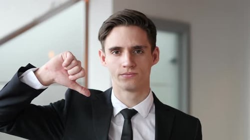 Okay Ok Sign By Young Businessman in Office
