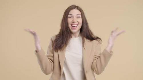 Excited young woman cheering and celebrating success