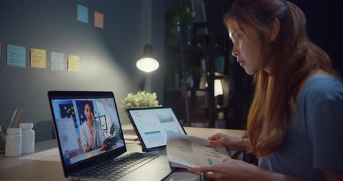 Woman Attends Virtual Meeting in Home Office