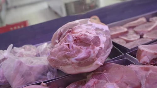 Frozen meat for sale at grocery supermarket counter. Food safety. Close-up. Argentina.