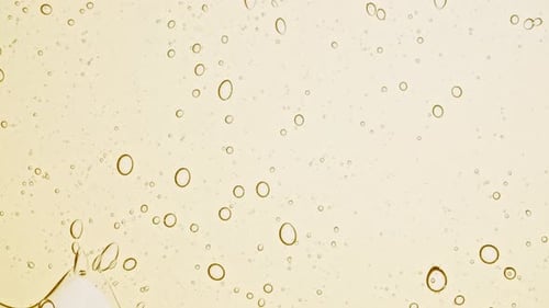 Abstract Yellow Liquid Motion with Bubbles