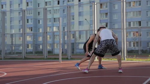 Two Guy Play Basketball at District Sports Ground