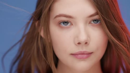 Beautiful Woman Smiling with Wind Blowing Through Hair