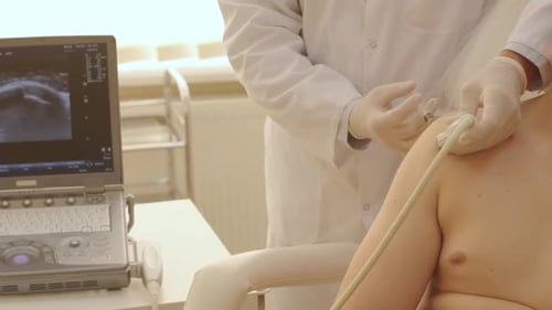 Doctor Uses Ultrasound on Patient's Shoulder