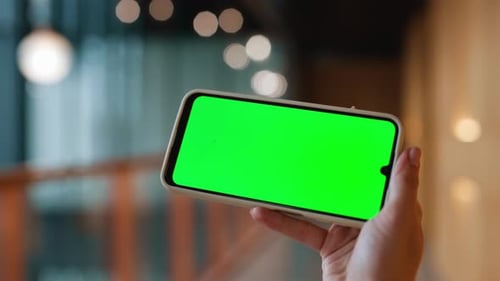 Freelancer Holding Greenscreen Smartphone in Office Closeup Unknown Woman