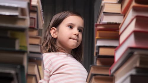 Little Girl Surrounded By Stacks of Books Thinking Which Book to Choose to Read