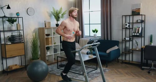 Adult Man Running on Treadmill at Home