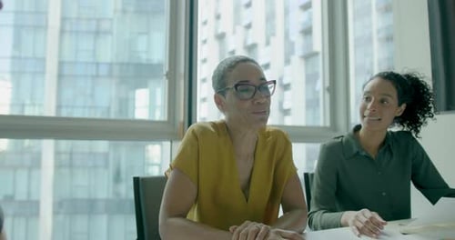 Three Businesswomen, Meeting and Working in Office