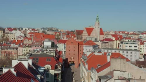 Aerial Motion Over Street Old Buildings With Brown Roofs